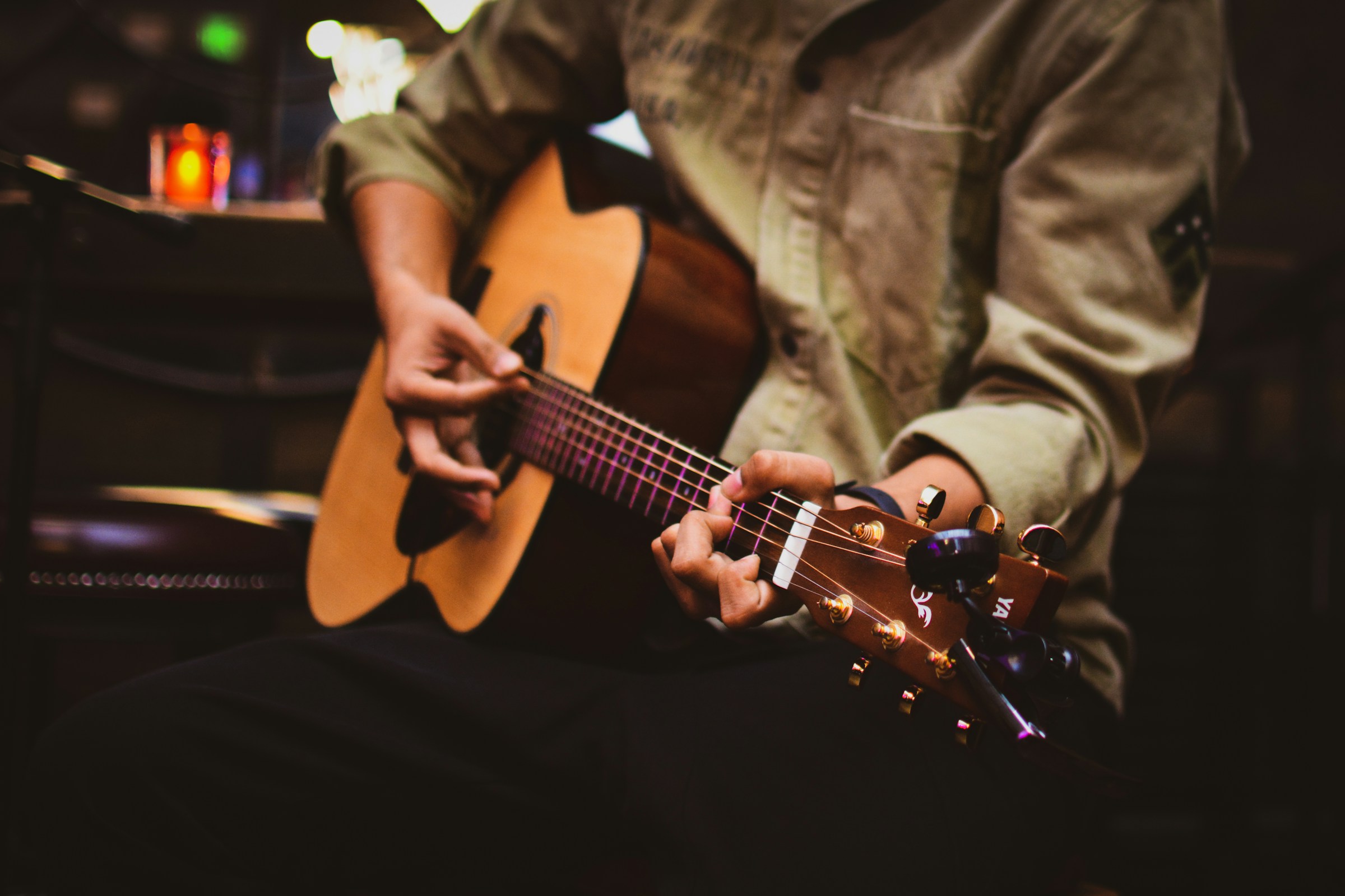 Acoustic guitar strings being played